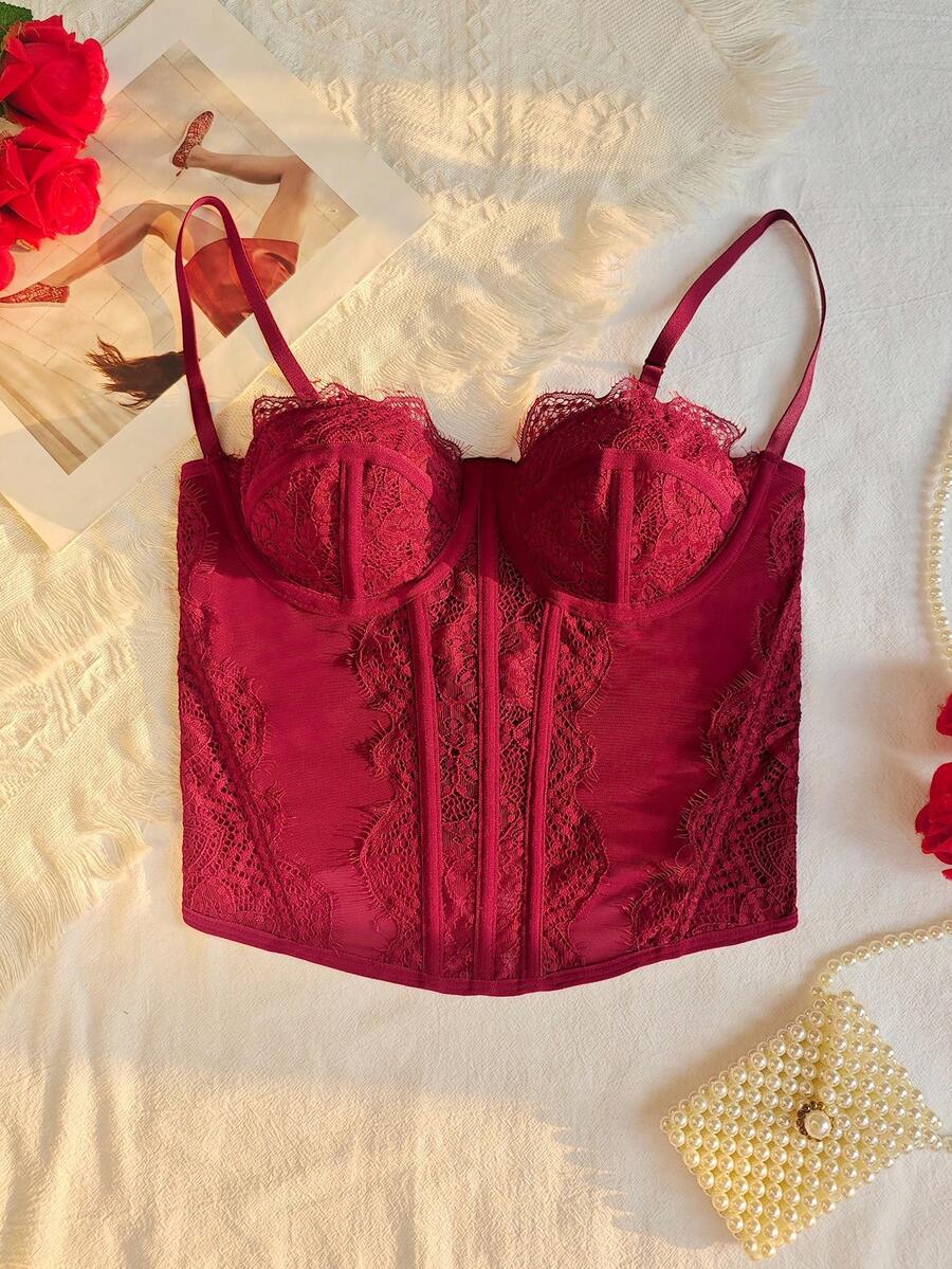 Women's brown lace trim cami corset crop top featuring a low cut neck, unlined body, and slim fit bodycon silhouette.