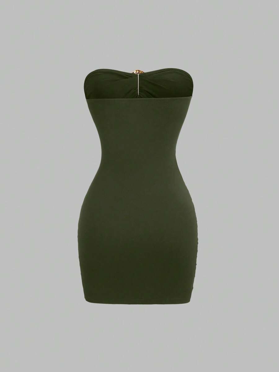 Women's black strapless bodycon mini dress featuring ruched detailing, cut-out design with ring accent, mid-waist pencil hem, and slim fit knitted stretch fabric.