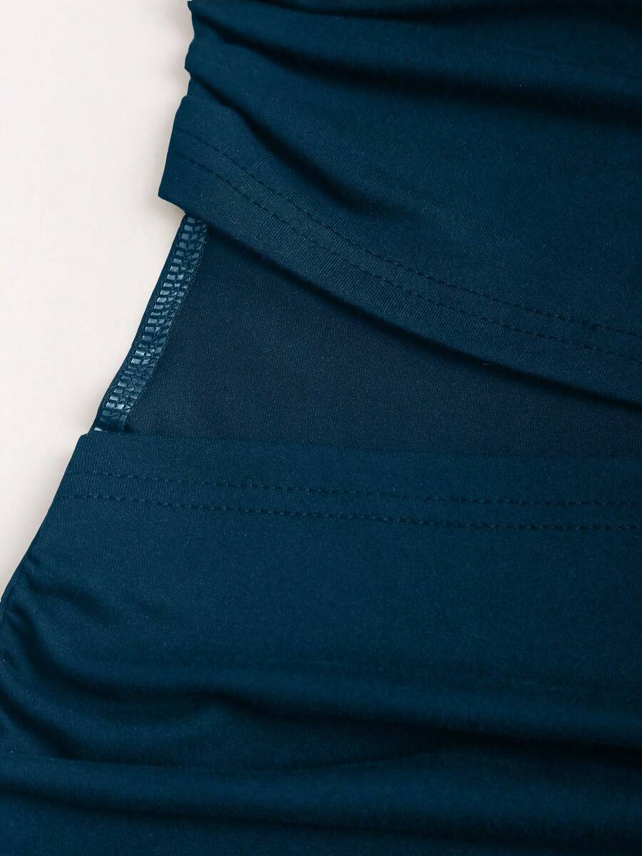 Women's black strapless bodycon mini dress featuring ruched detailing, cut-out design with ring accent, mid-waist pencil hem, and slim fit knitted stretch fabric.