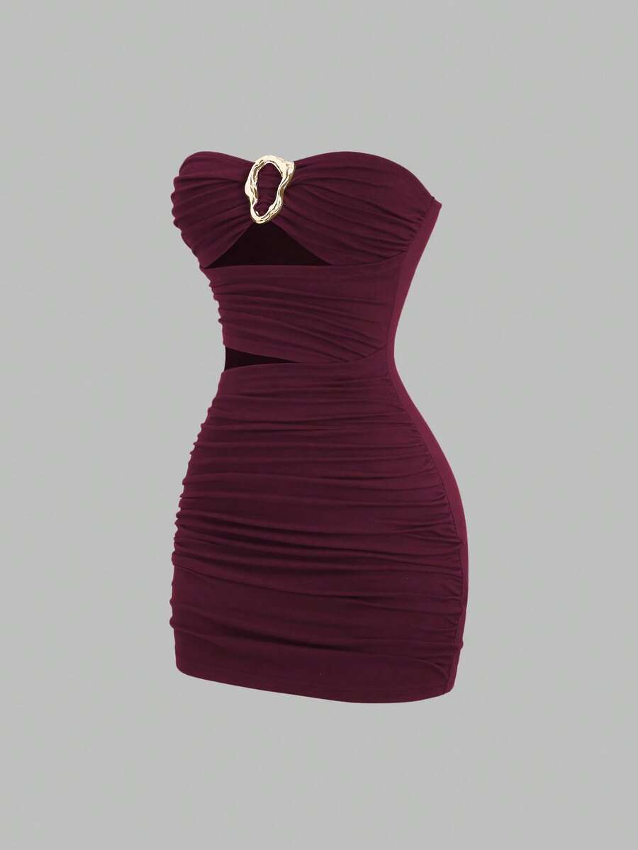 Women's black strapless bodycon mini dress featuring ruched detailing, cut-out design with ring accent, mid-waist pencil hem, and slim fit knitted stretch fabric.