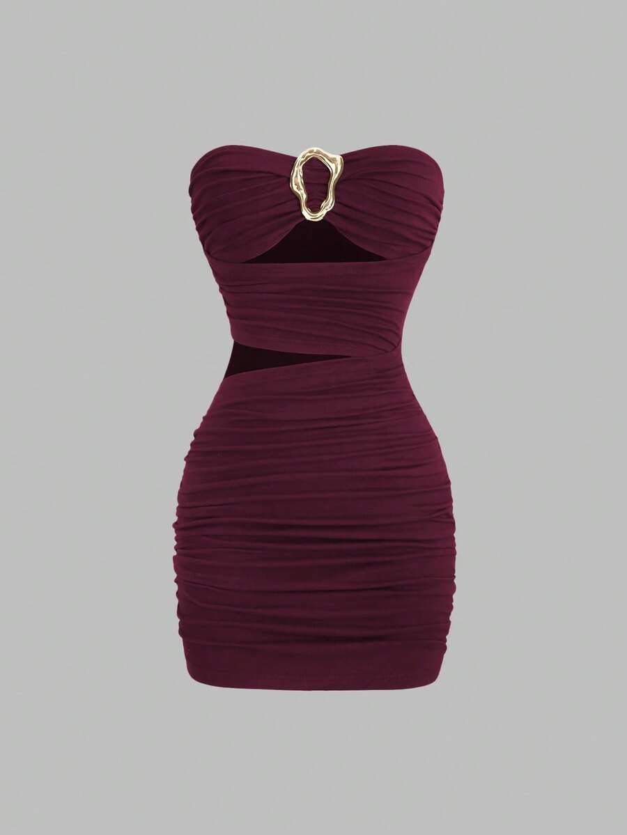 Women's black strapless bodycon mini dress featuring ruched detailing, cut-out design with ring accent, mid-waist pencil hem, and slim fit knitted stretch fabric.