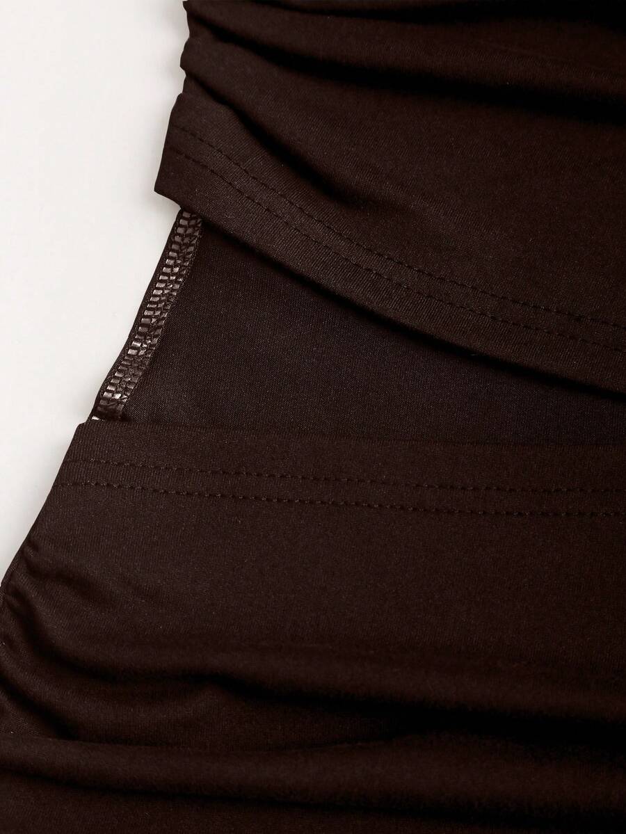 Women's black strapless bodycon mini dress featuring ruched detailing, cut-out design with ring accent, mid-waist pencil hem, and slim fit knitted stretch fabric.