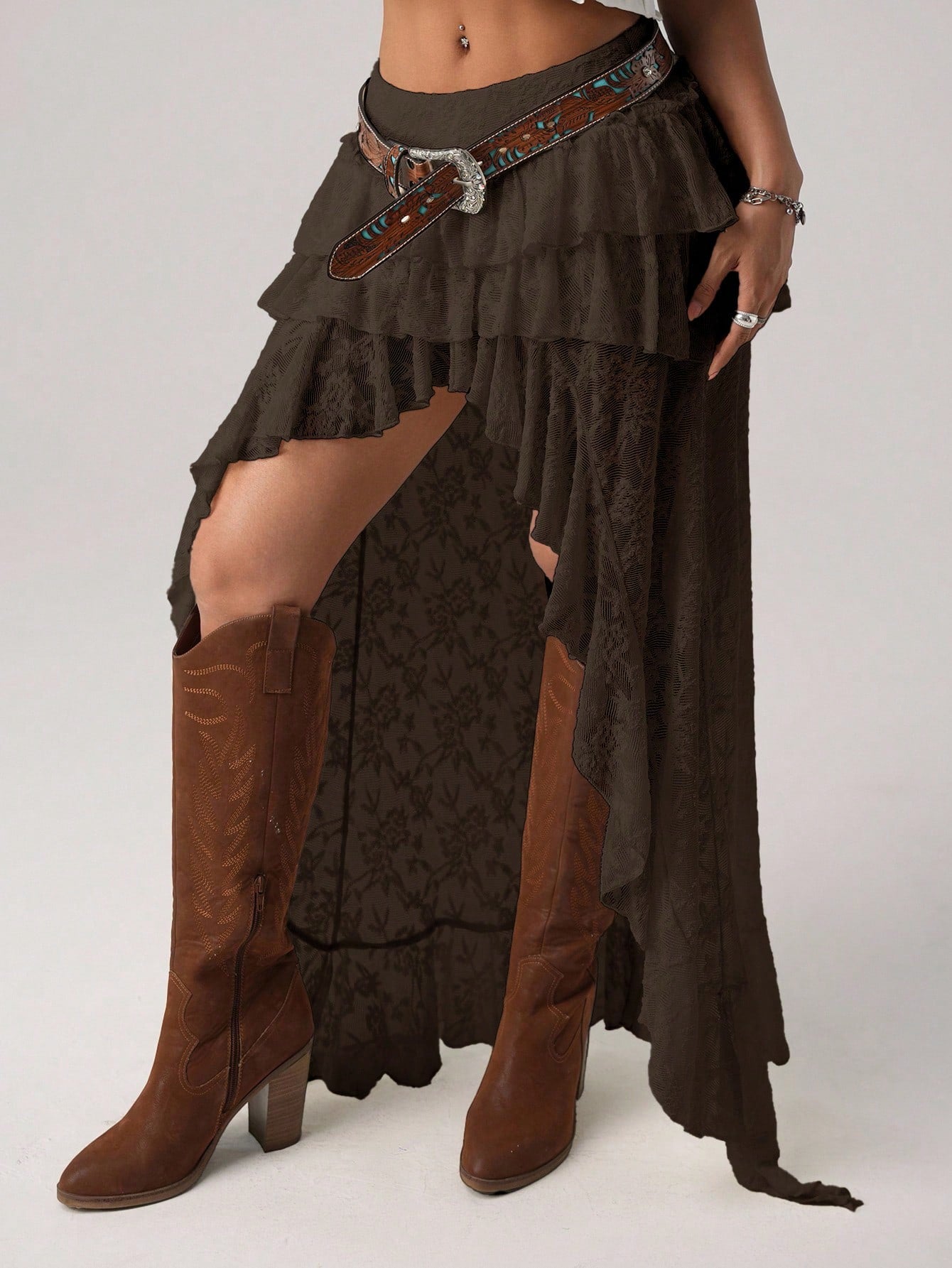 Women's lace tiered asymmetrical maxi skirt featuring a low waist and high slit thigh design.