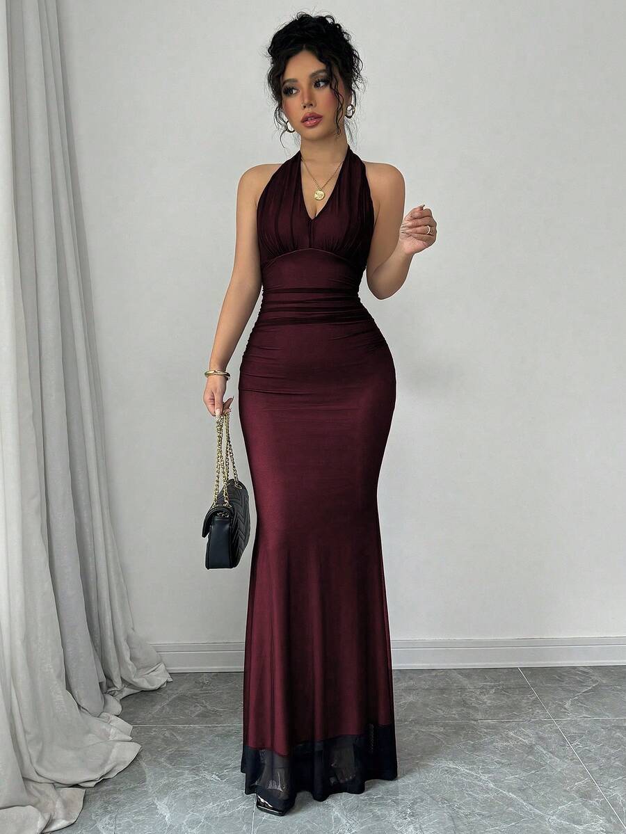 Women's long sleeve mermaid bodycon dress in high-stretch mesh fabric featuring a halter backless neckline, ruched high waist, and slim fit silhouette for formal evening wear.