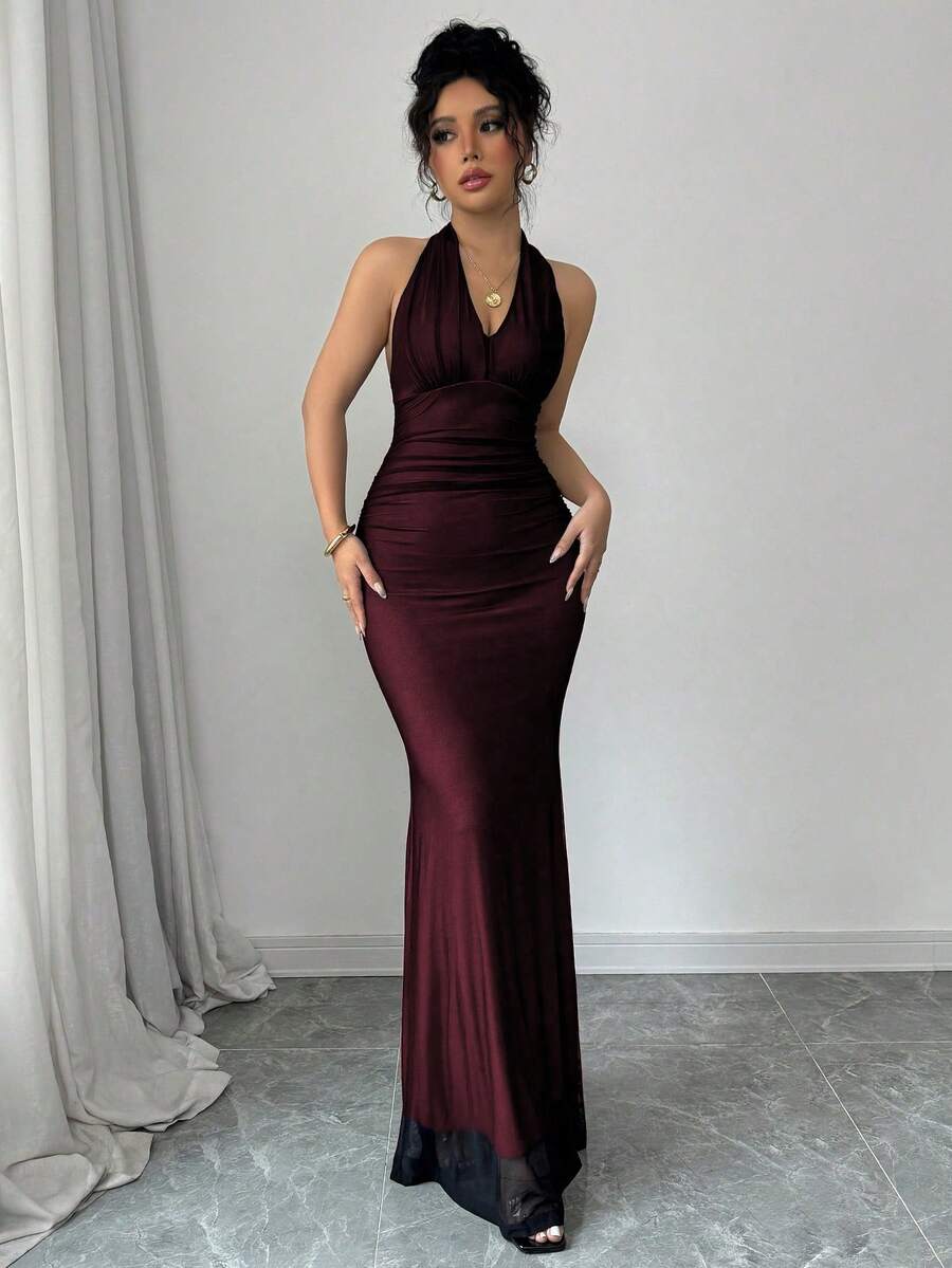 Women's long sleeve mermaid bodycon dress in high-stretch mesh fabric featuring a halter backless neckline, ruched high waist, and slim fit silhouette for formal evening wear.
