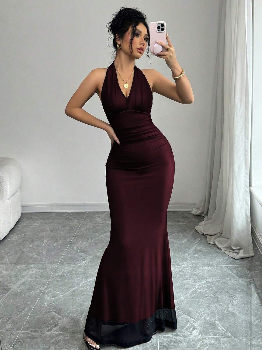 Women's long sleeve mermaid bodycon dress in high-stretch mesh fabric featuring a halter backless neckline, ruched high waist, and slim fit silhouette for formal evening wear.
