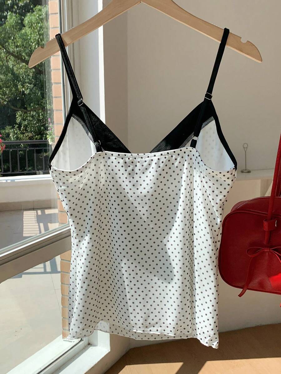Black and white polka dot tie strap camisole top for women with thin spaghetti straps and slim fit.