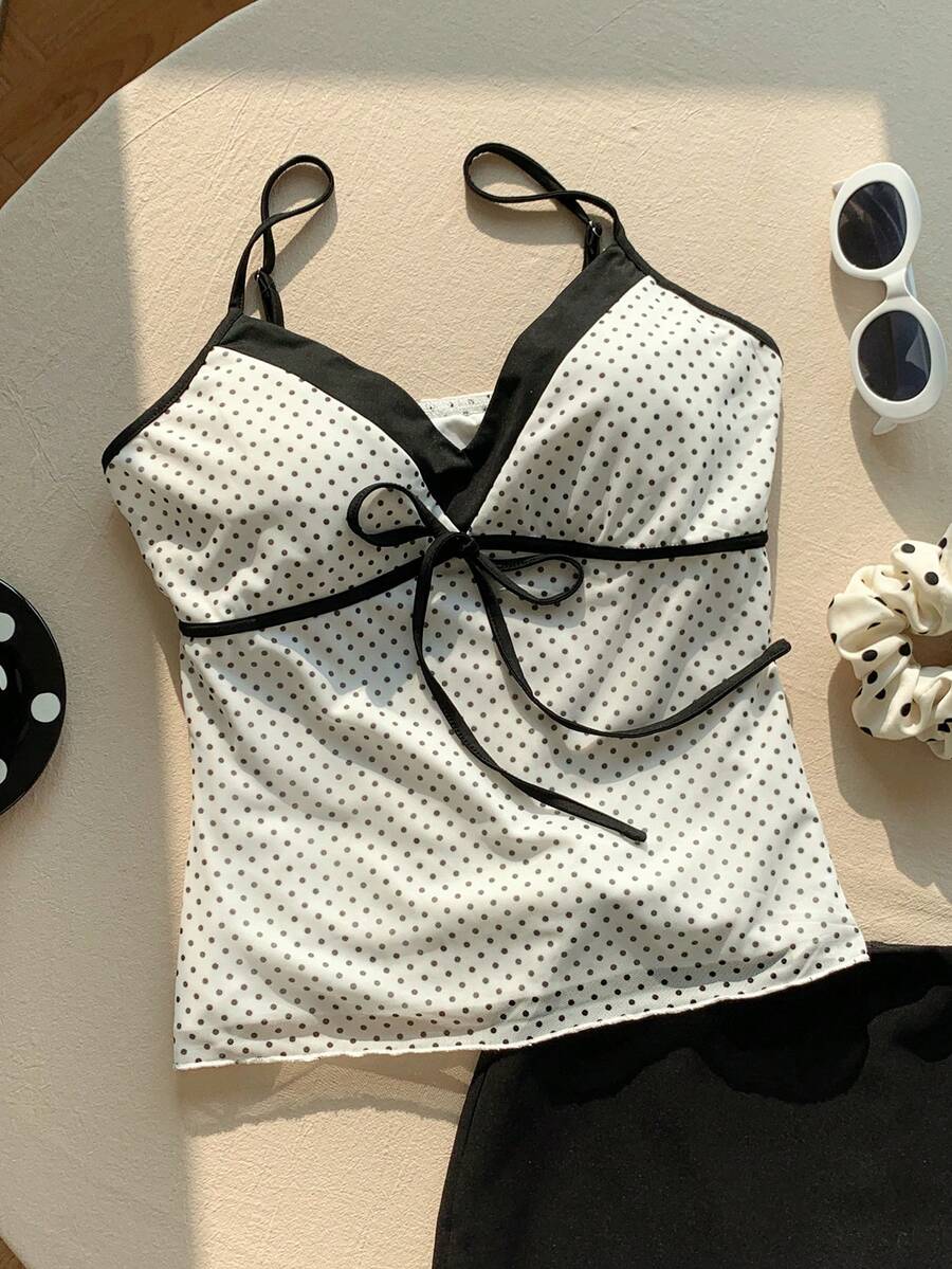 Black and white polka dot tie strap camisole top for women with thin spaghetti straps and slim fit.