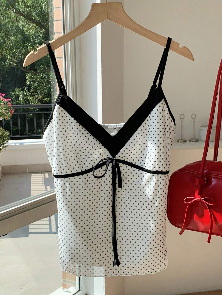 Black and white polka dot tie strap camisole top for women with thin spaghetti straps and slim fit.
