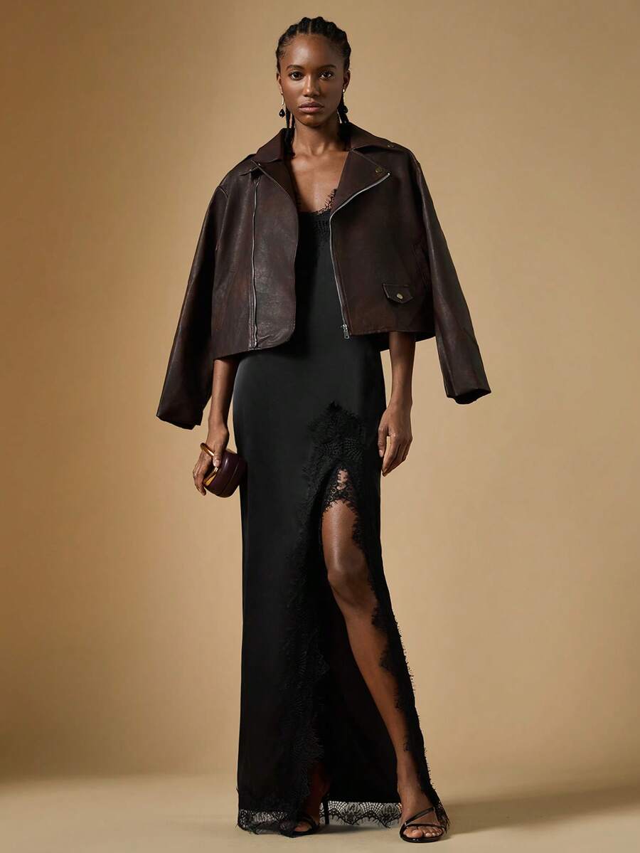 Women's black lace split satin long dress featuring spaghetti straps, asymmetrical slit hem, and matching arm sleeves.