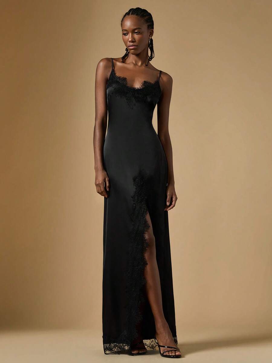 Women's black lace split satin long dress featuring spaghetti straps, asymmetrical slit hem, and matching arm sleeves.