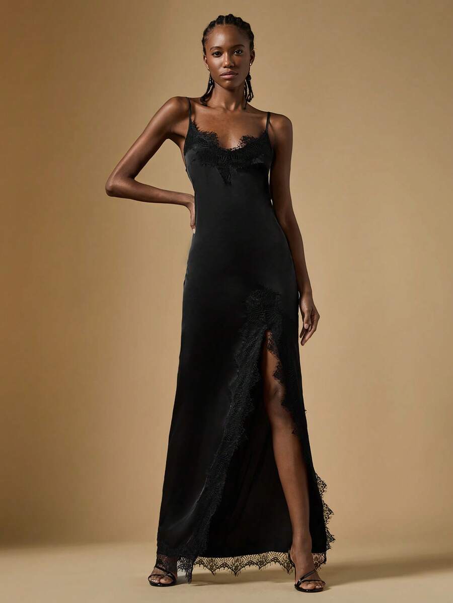 Women's black lace split satin long dress featuring spaghetti straps, asymmetrical slit hem, and matching arm sleeves.