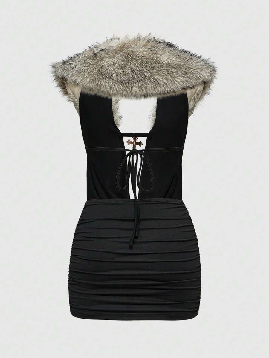 Women's black halter bodycon mini dress with deep V neckline, chain detail, backless design, and contrast faux fur accent.