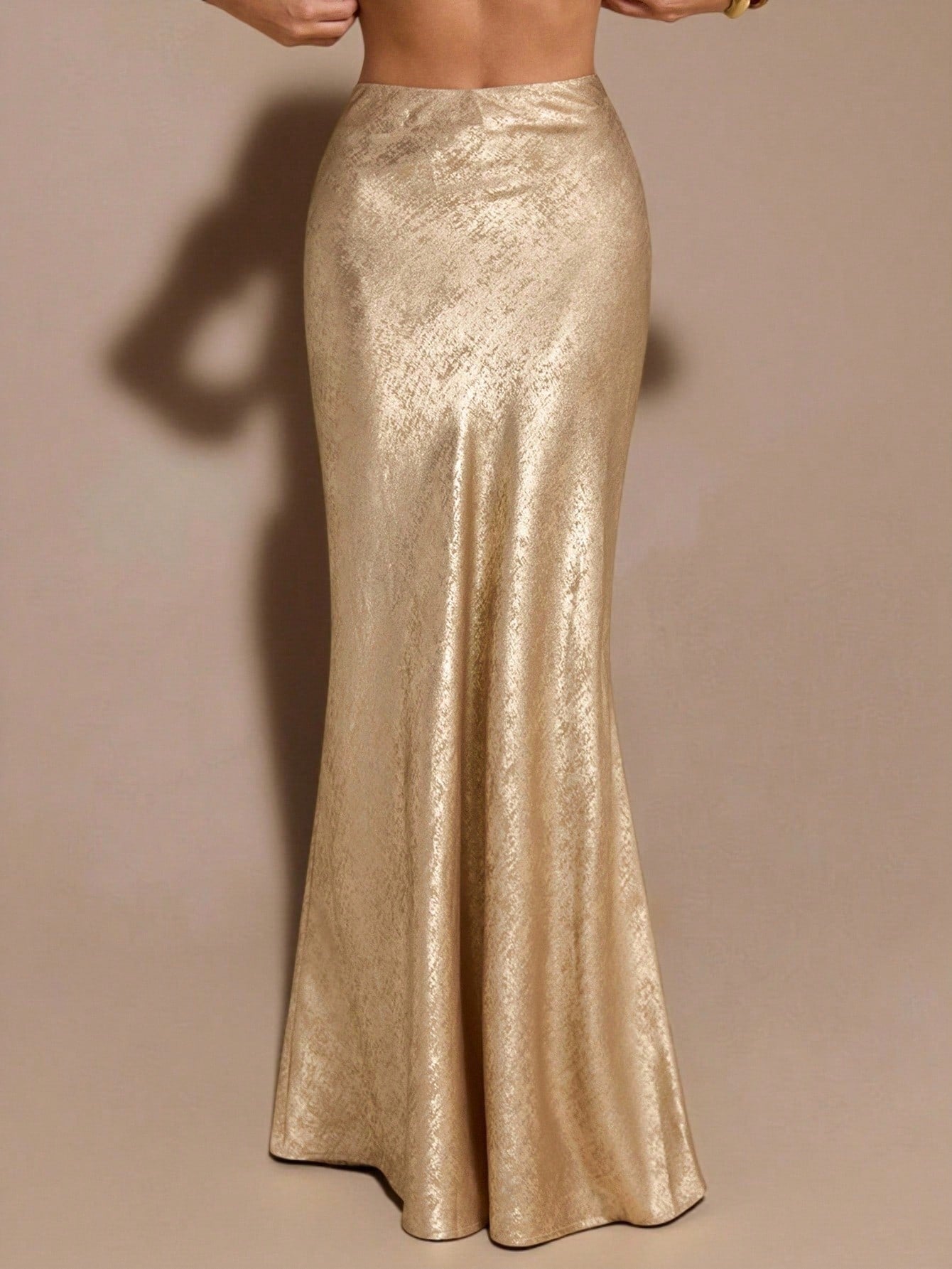 Black low waist extra long mermaid maxi skirt with asymmetrical zipper detail and side slit.