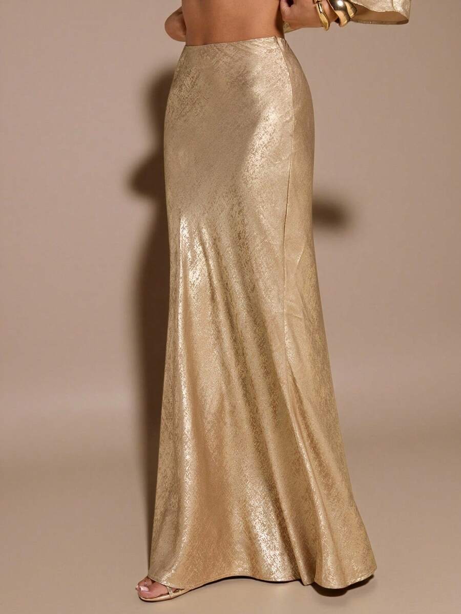 Black low waist extra long mermaid maxi skirt with asymmetrical zipper detail and side slit.