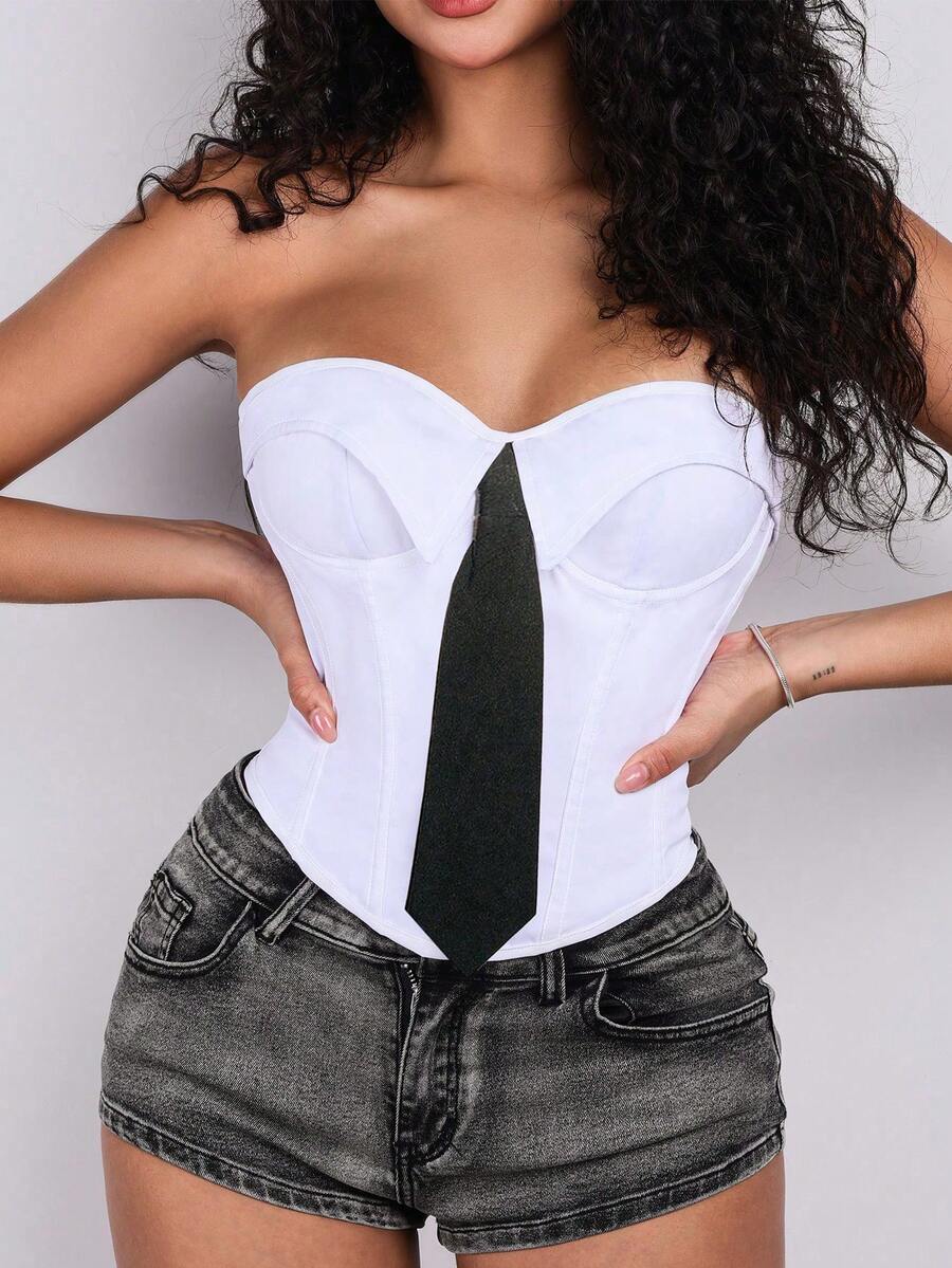 Women's white cropped tube top featuring a strapless backless design and asymmetrical hem in a slim fit style.
