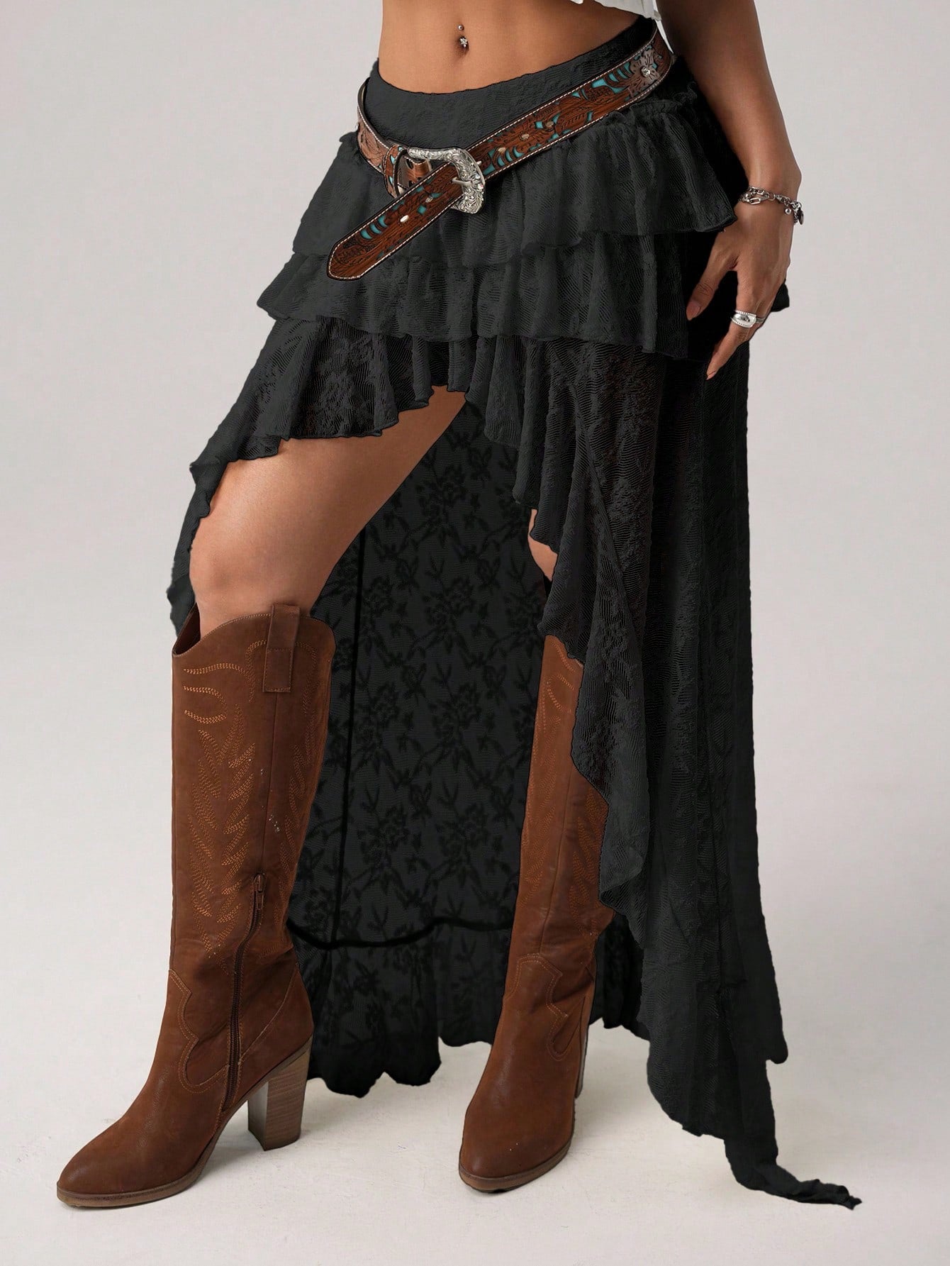 Women's lace tiered asymmetrical maxi skirt featuring a low waist and high slit thigh design.