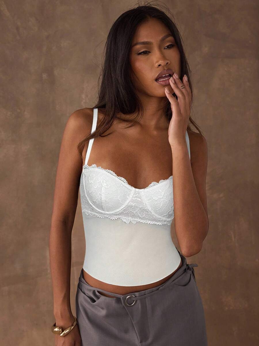 Women's black contrast lace camisole with spaghetti straps, cup detail, semi-sheer finish, and slim fit for going out or date night.