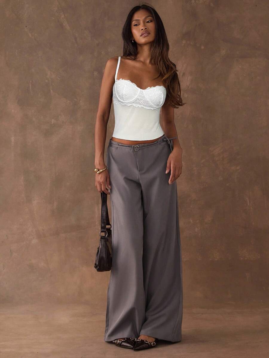 Women's black contrast lace camisole with spaghetti straps, cup detail, semi-sheer finish, and slim fit for going out or date night.
