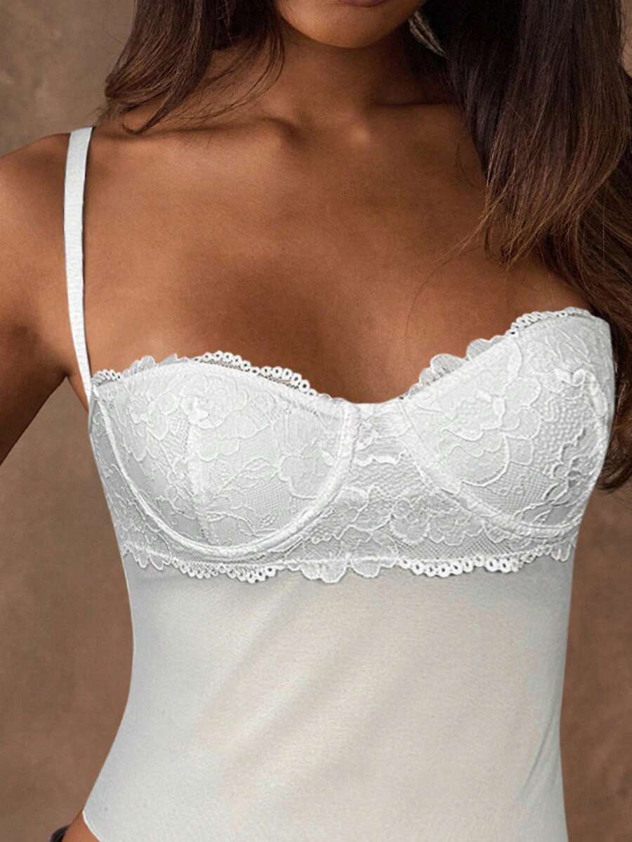 Women's black contrast lace camisole with spaghetti straps, cup detail, semi-sheer finish, and slim fit for going out or date night.