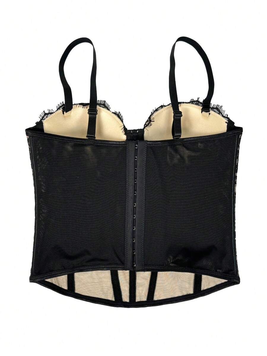 Black women's shaping cami with contrast lace, spaghetti straps, asymmetrical hem, lined body, and slim fit for casual and night-out styling.