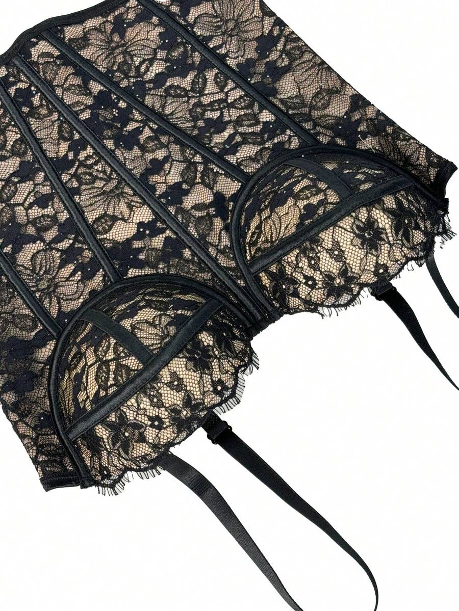 Black women's shaping cami with contrast lace, spaghetti straps, asymmetrical hem, lined body, and slim fit for casual and night-out styling.