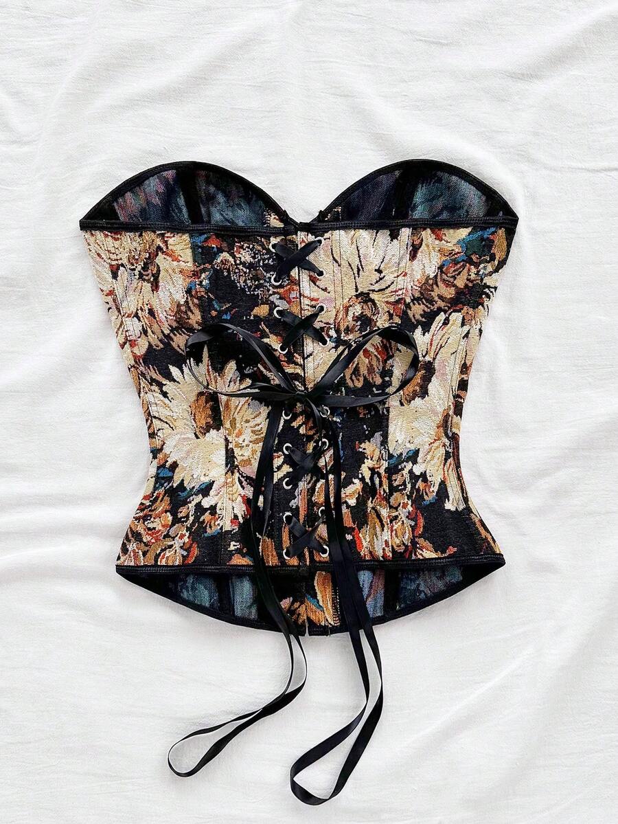 Strapless black lace-up corset top for women with grommet eyelet details, slim fit, lined body, and woven fabric construction.