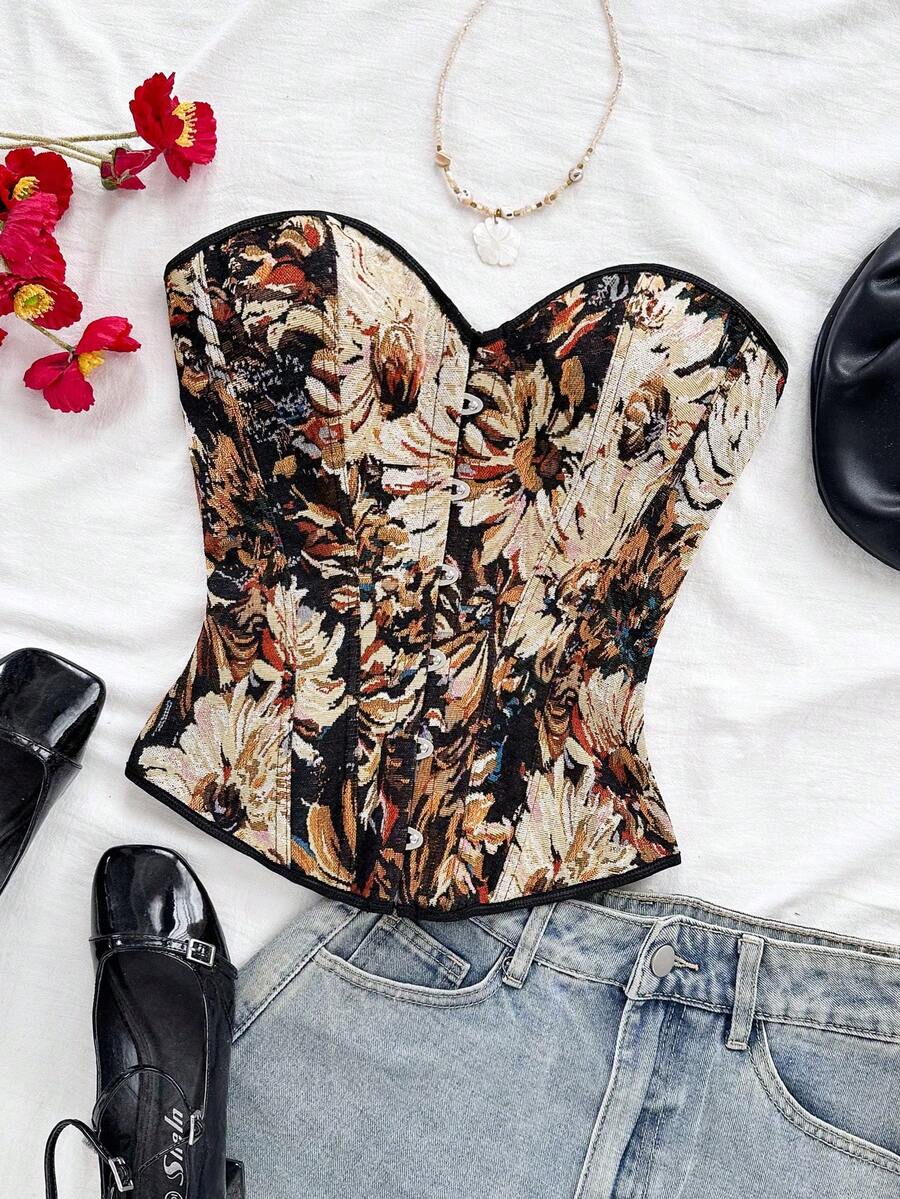Strapless black lace-up corset top for women with grommet eyelet details, slim fit, lined body, and woven fabric construction.