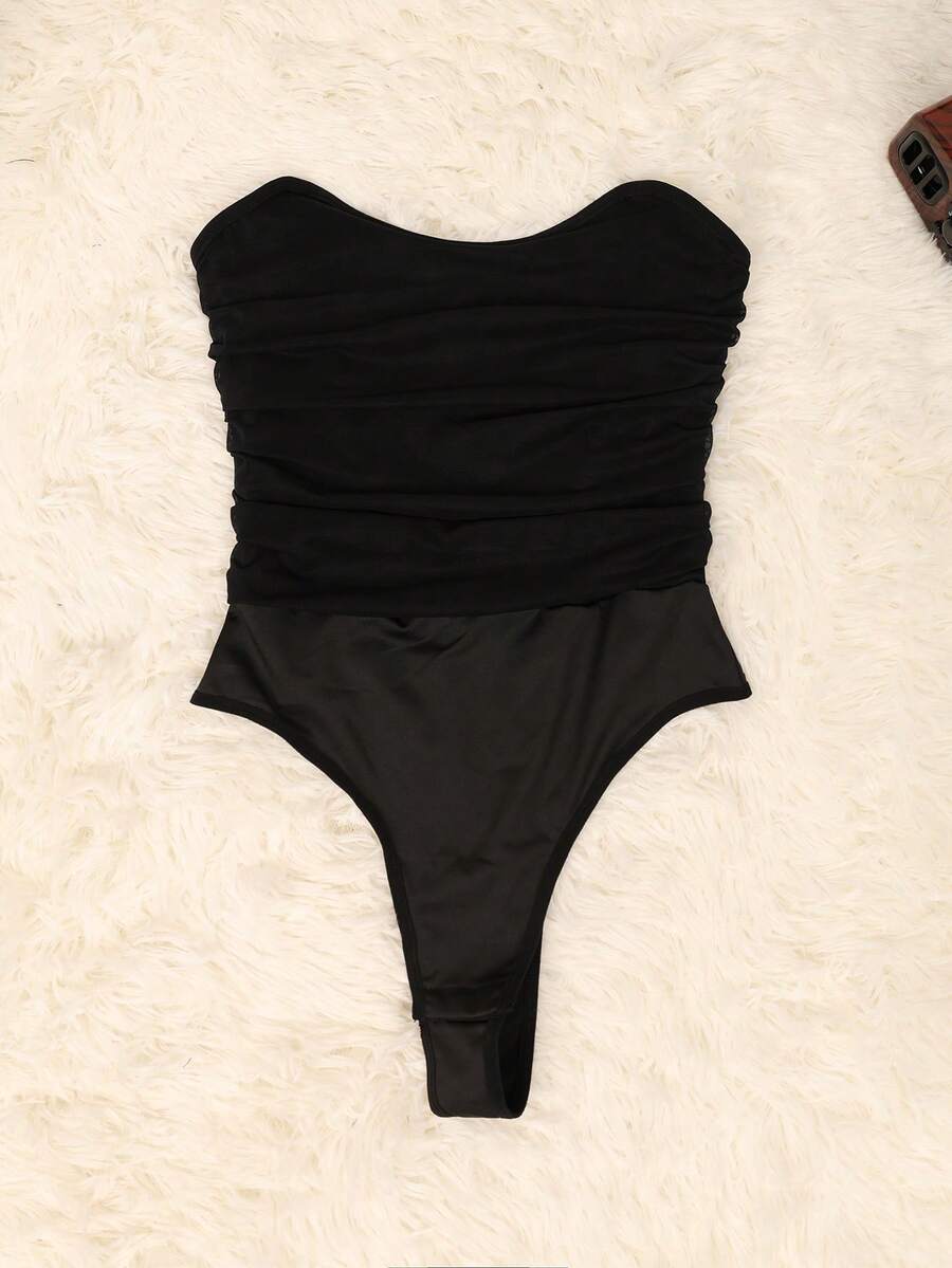 Black mesh ruched tube corset top for women featuring a strapless and backless slim fit design.