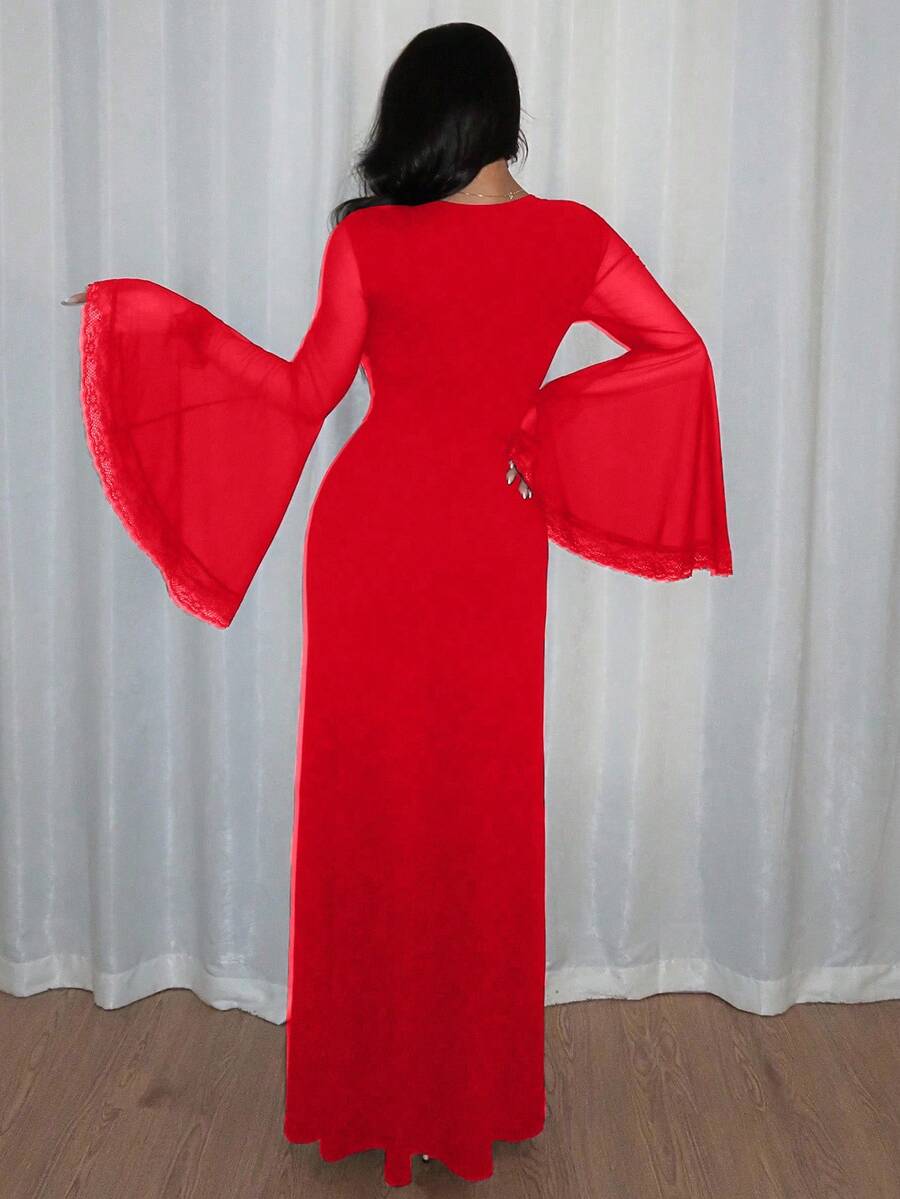 Women's slim-fit long goth dress in black featuring a deep V-neckline, extra-long flared sleeves, and a split thigh detail.