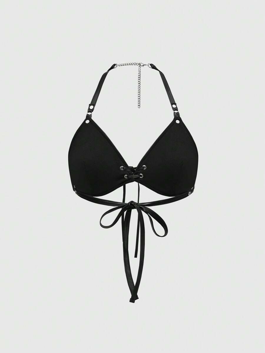 Women wearing a black flame patch PU halter micro crop top featuring a backless lace-up design and matching arm sleeves.