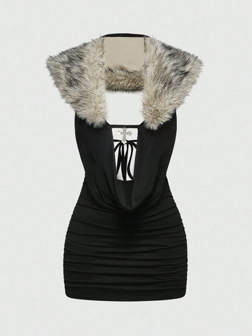 Women's black halter bodycon mini dress with deep V neckline, chain detail, backless design, and contrast faux fur accent.