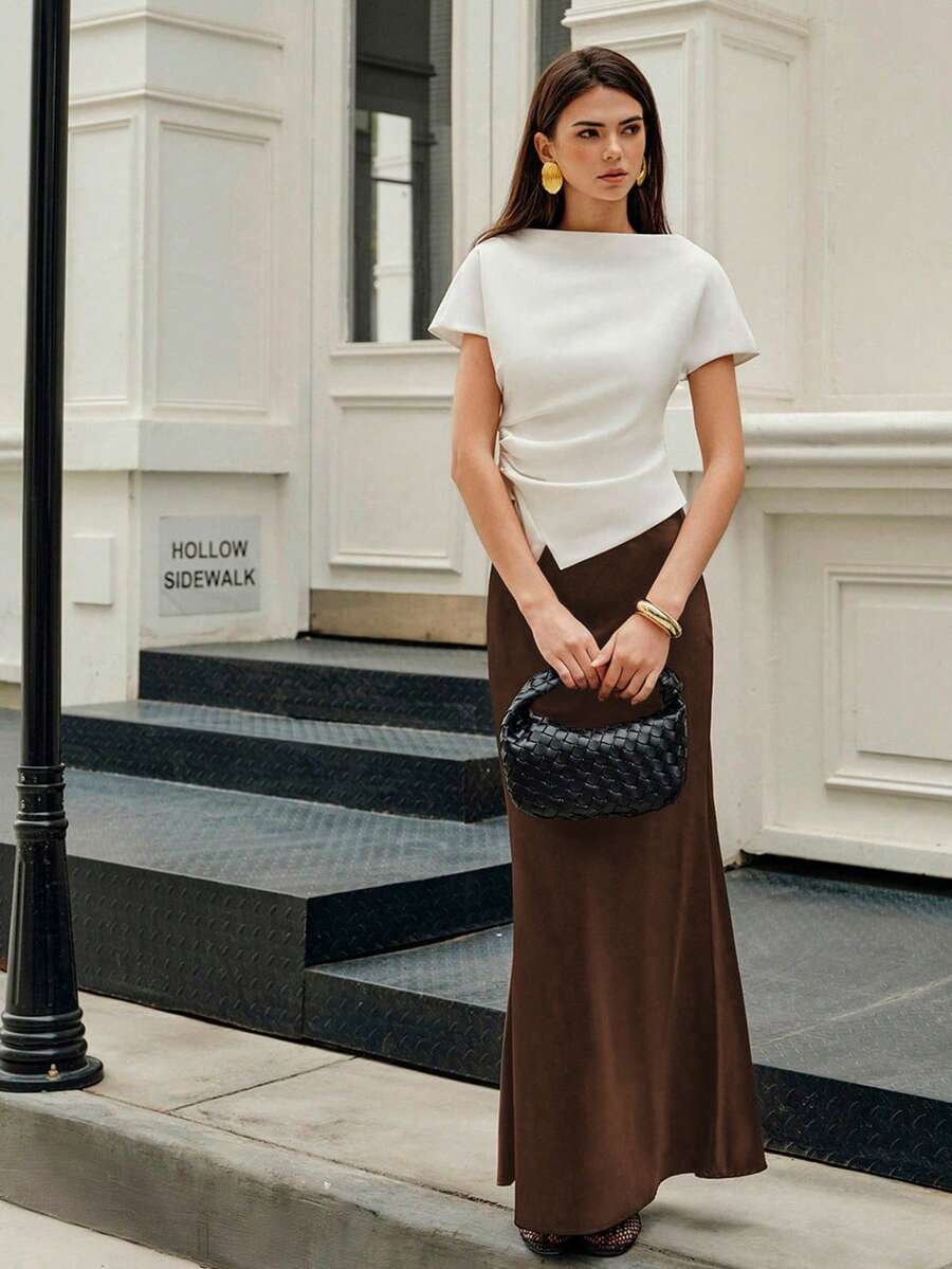 Elegant plain black mid waist long satin skirt for women featuring a sleek zipper closure and regular fit.