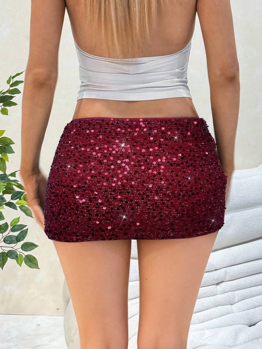 Women's black sequin bodycon mini skirt with low waist and zipper detail for party night out