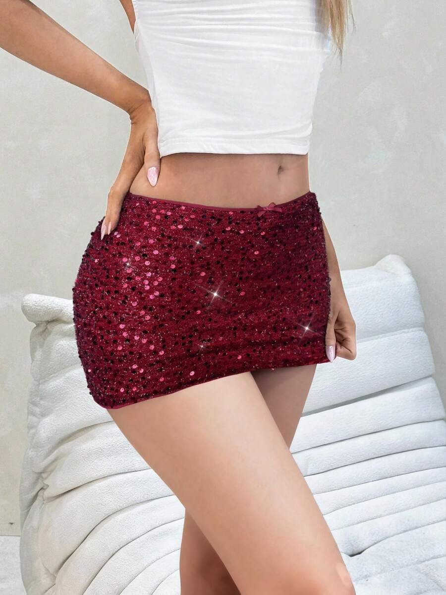 Women's black sequin bodycon mini skirt with low waist and zipper detail for party night out