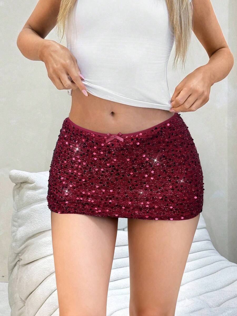 Women's black sequin bodycon mini skirt with low waist and zipper detail for party night out