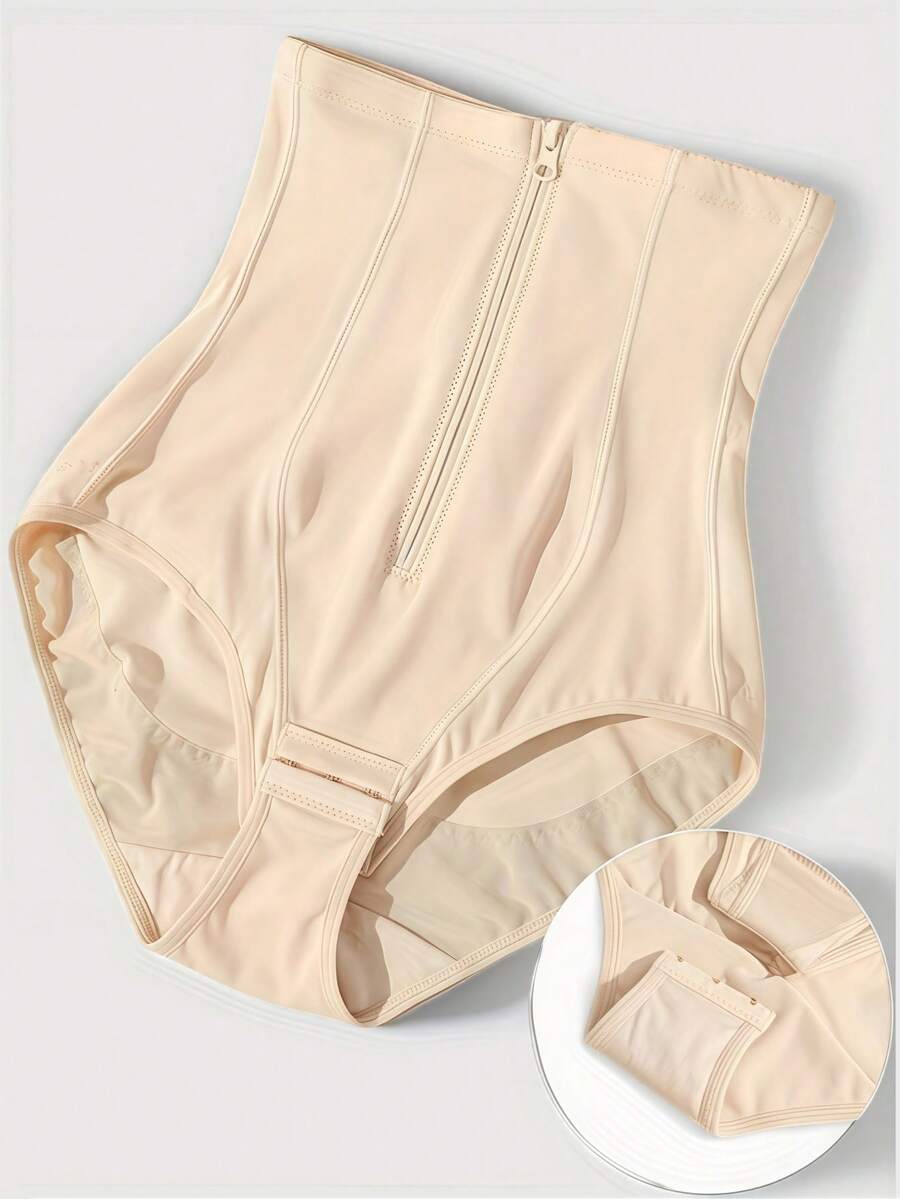 Women's black super high waist shaping pants with zipper closure, strong tummy control, and butt lifting feature.