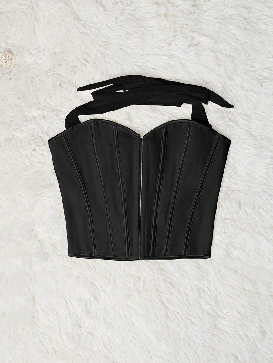 White Y2K halter backless corset top featuring lace-up back detail and metal grommet eyelets for women