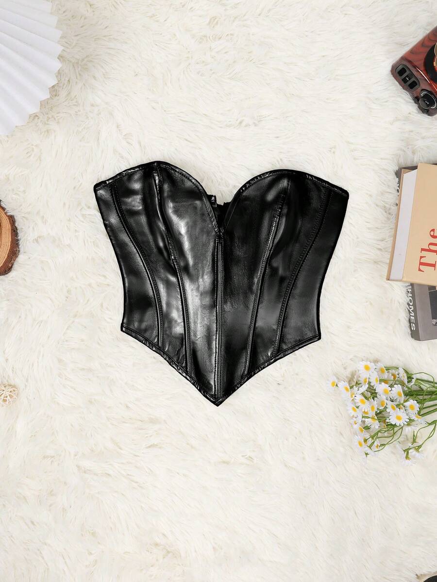 Black PU leather lace-up bustier crop top for women by Apperloth featuring a strapless asymmetrical hem with grommet eyelets.