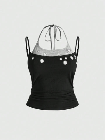 Black halter crop tank top for women featuring lace up front details, ruched accents, and appliques in a slim fit knitted fabric.