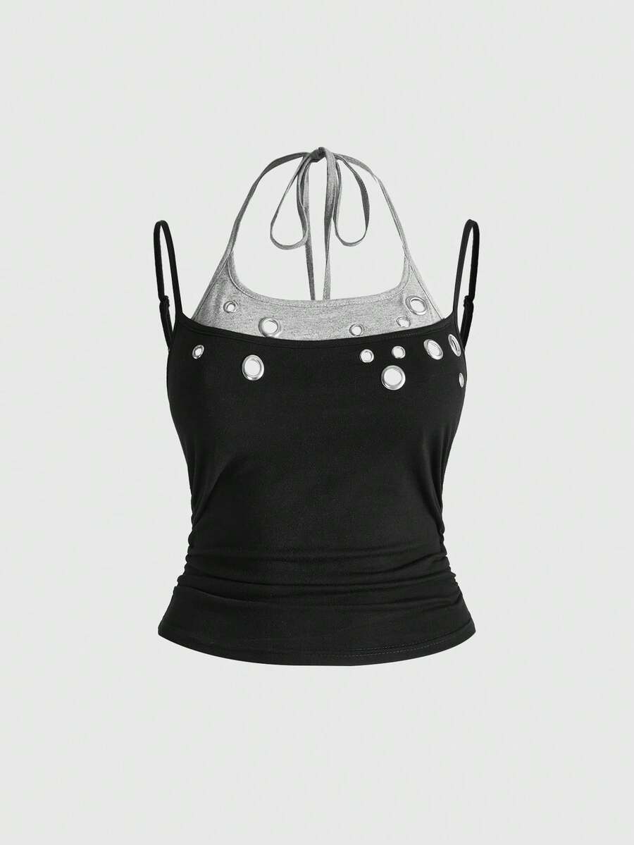 Black halter crop tank top for women featuring lace up front details, ruched accents, and appliques in a slim fit knitted fabric.