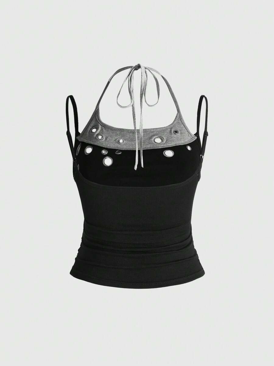 Black halter crop tank top for women featuring lace up front details, ruched accents, and appliques in a slim fit knitted fabric.