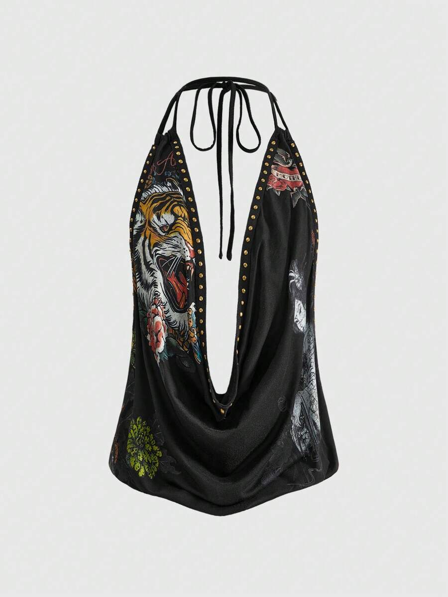 Women's black backless halter crop top featuring a V-neckline, tie-back detail, and asymmetrical hem.