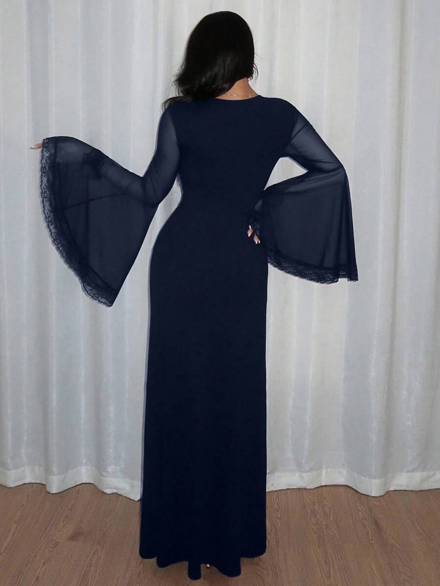 Women's slim-fit long goth dress in black featuring a deep V-neckline, extra-long flared sleeves, and a split thigh detail.