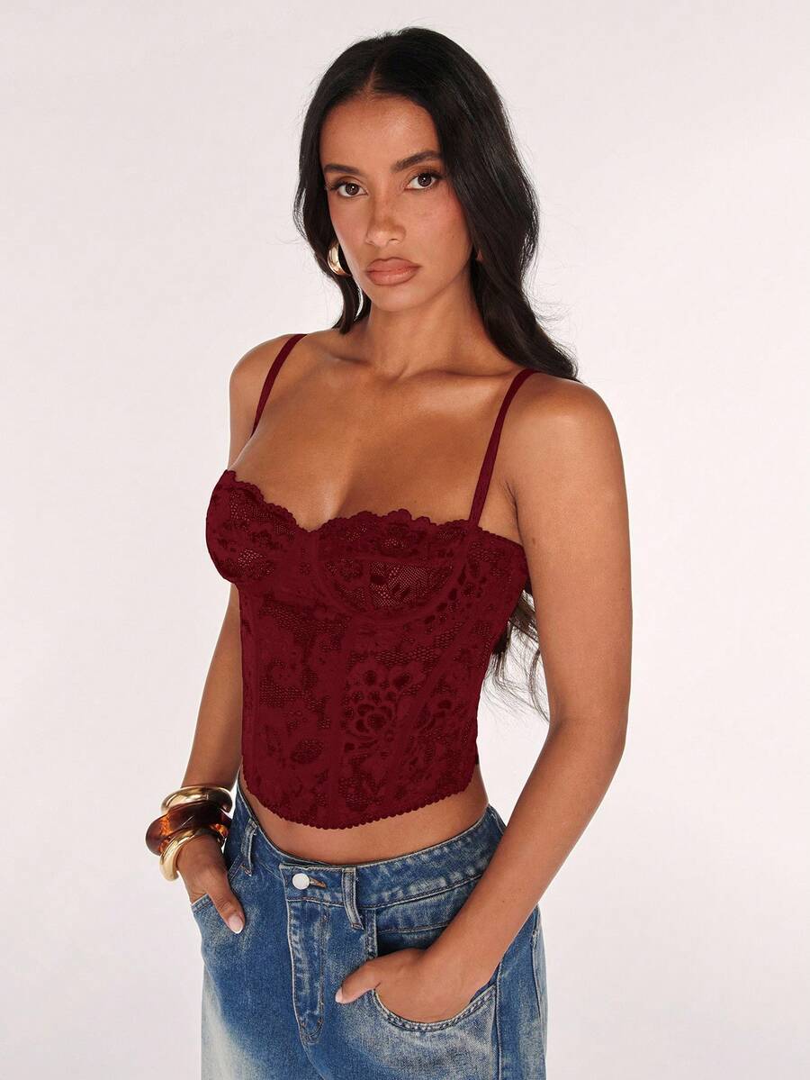 Women’s camisole top with cup detail, spaghetti straps, lined body, and slim fit design in knitted fabric with an asymmetrical hem.