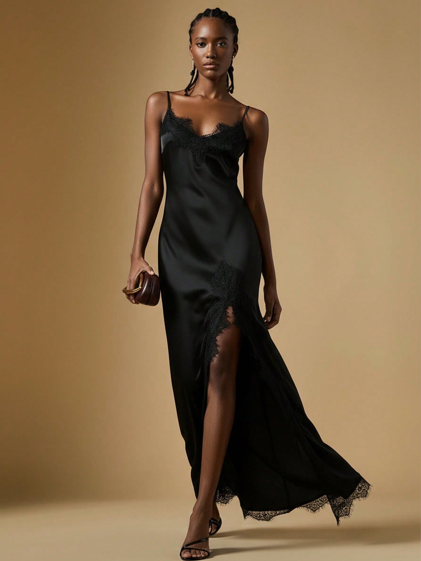 Women's black lace split satin long dress featuring spaghetti straps, asymmetrical slit hem, and matching arm sleeves.