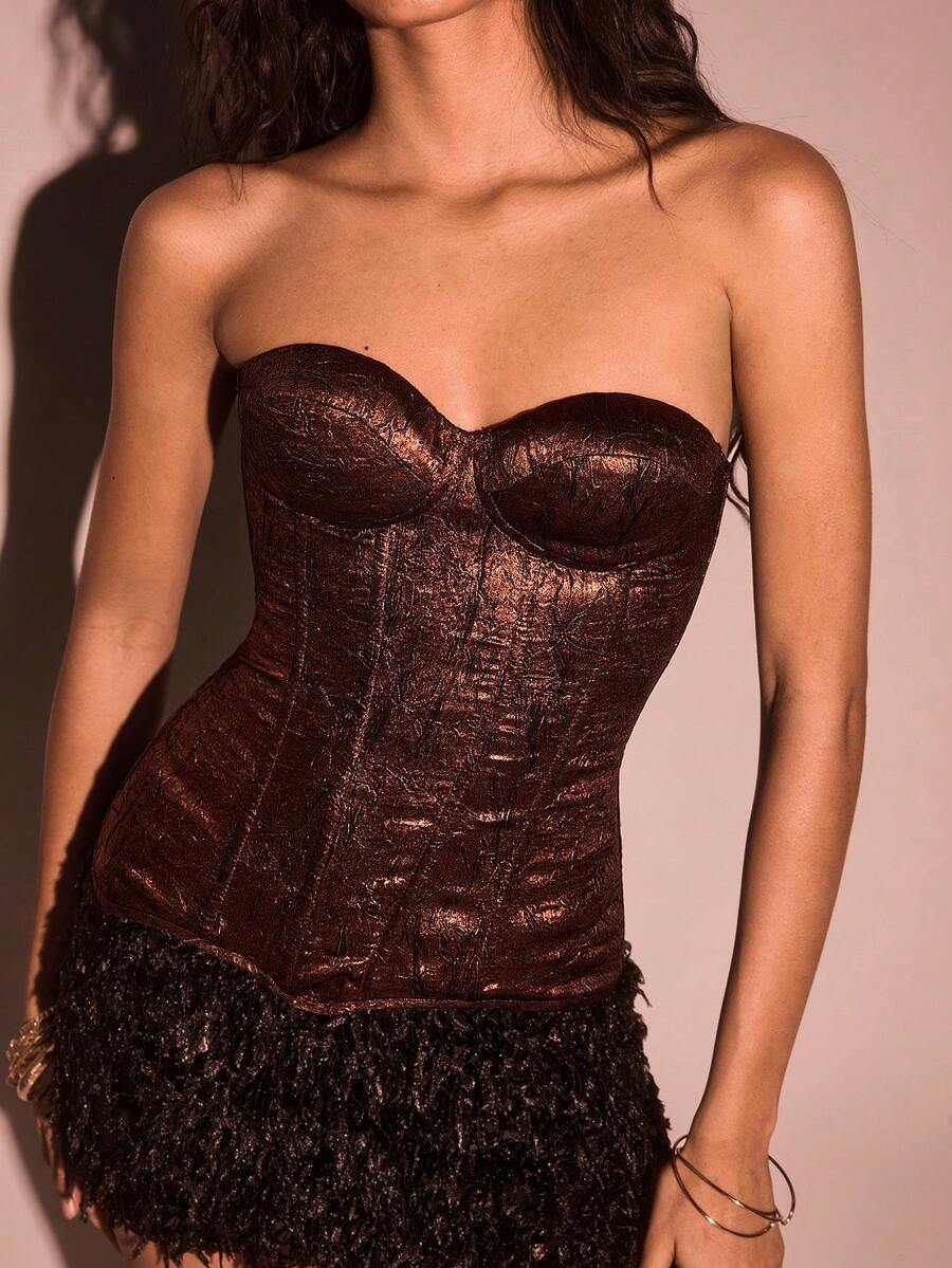 Women's brown strapless bustier crop top featuring a lace-up backless design with grommet eyelets and a boned corset fit.