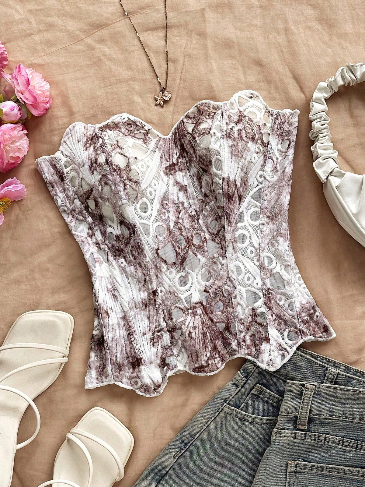 Strapless floral lace corset top with lace-up detail, asymmetrical hem, and slim fit for women.