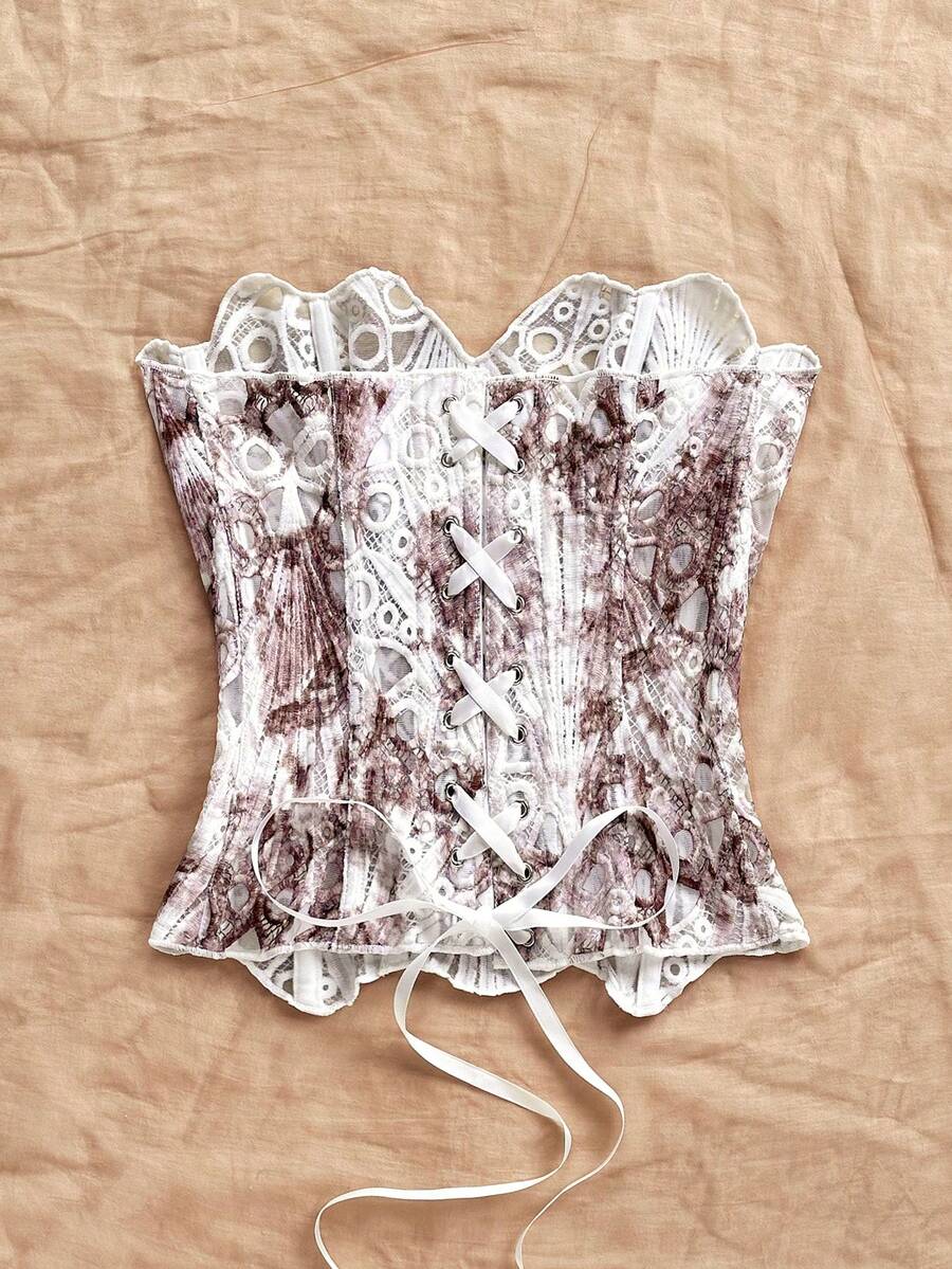 Strapless floral lace corset top with lace-up detail, asymmetrical hem, and slim fit for women.