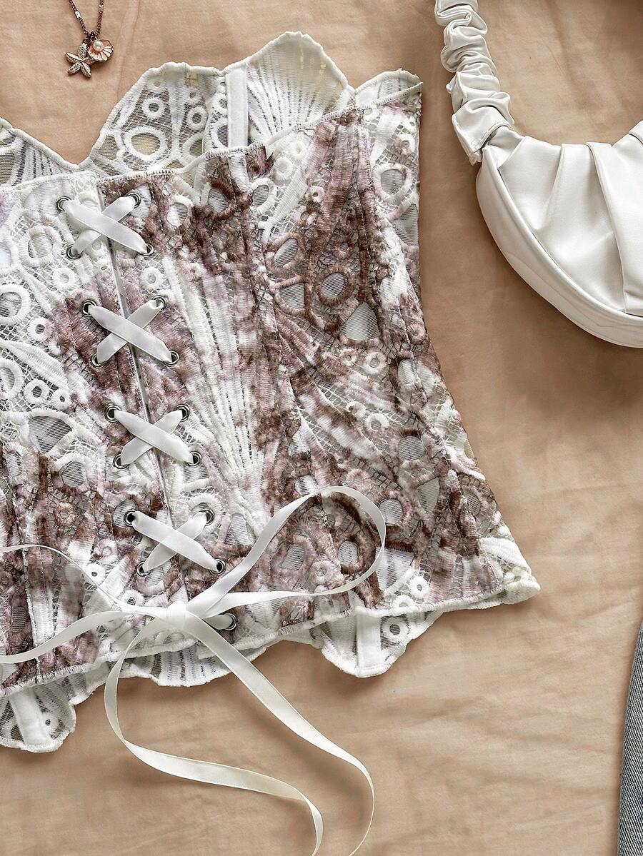 Strapless floral lace corset top with lace-up detail, asymmetrical hem, and slim fit for women.